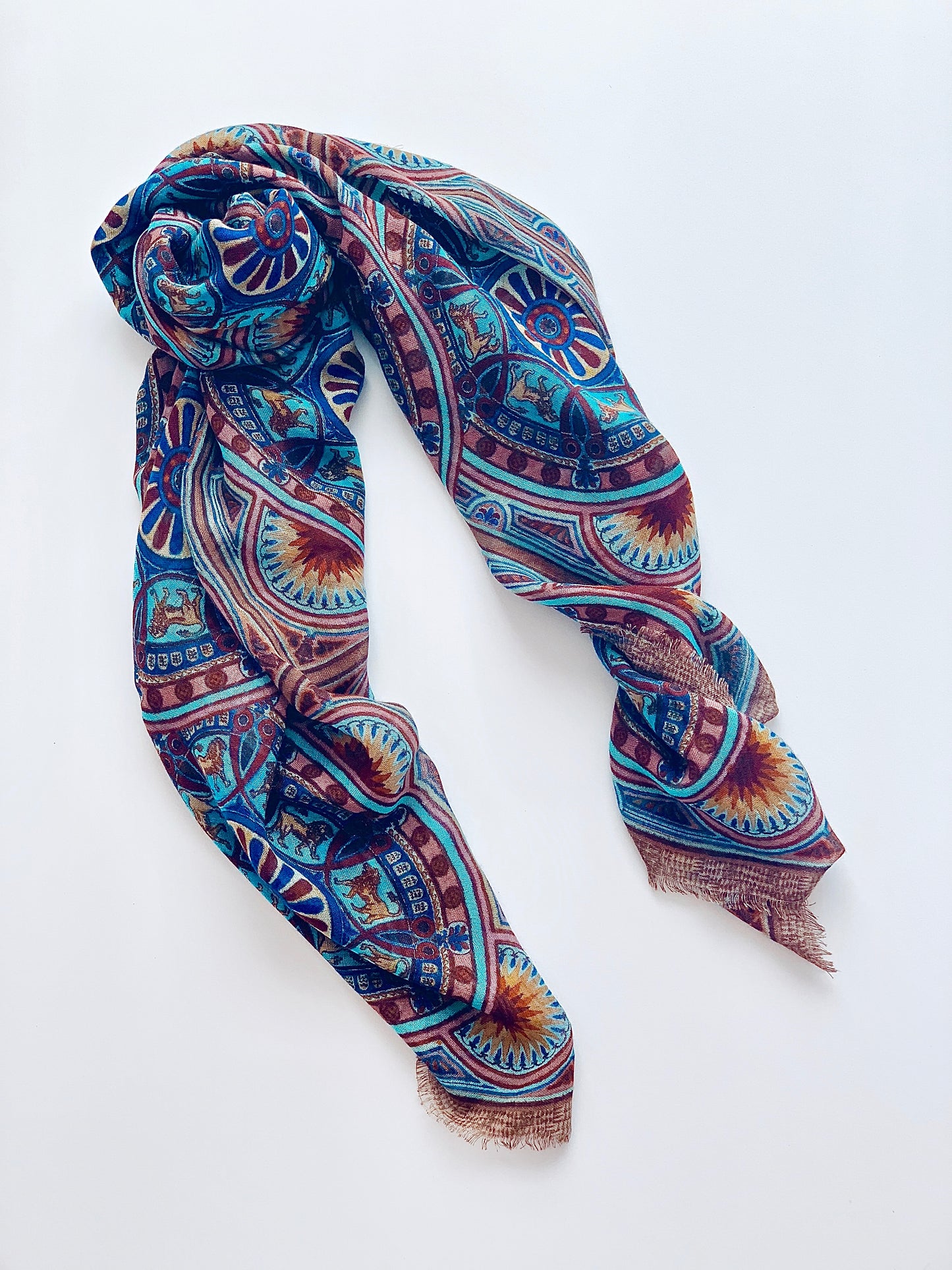 Lightweight wool and silk scarf . Striking pops of blue with sundials. 
