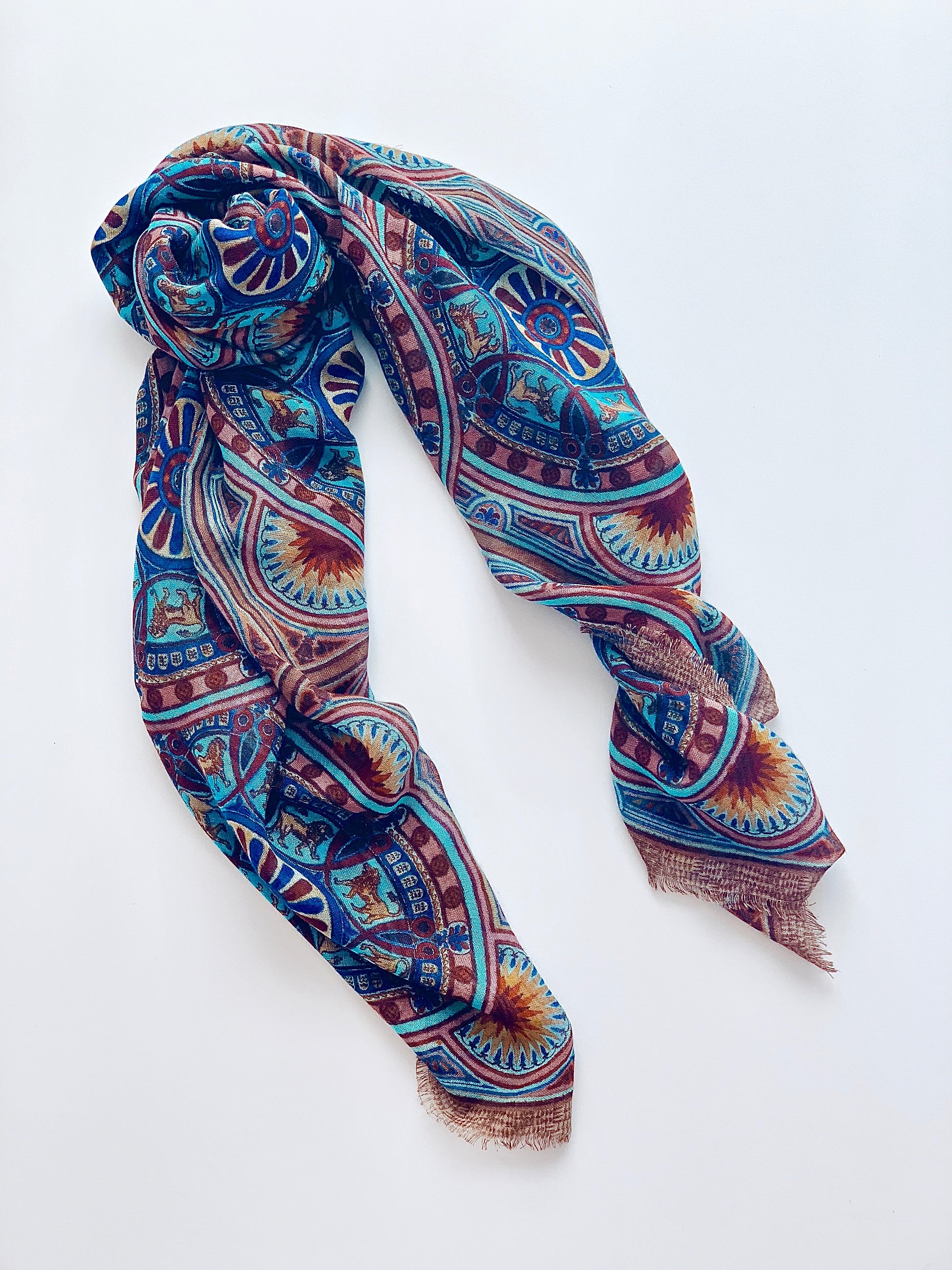 Lightweight wool and silk scarf . Striking pops of blue with sundials. 